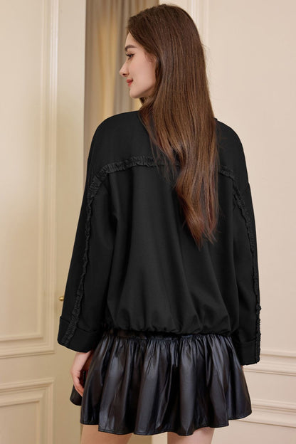 Back view of black jacket showing relaxed fit