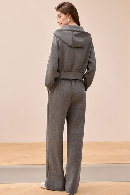 Back view of gray wide-leg jumpsuit with relaxed fit and straight cut