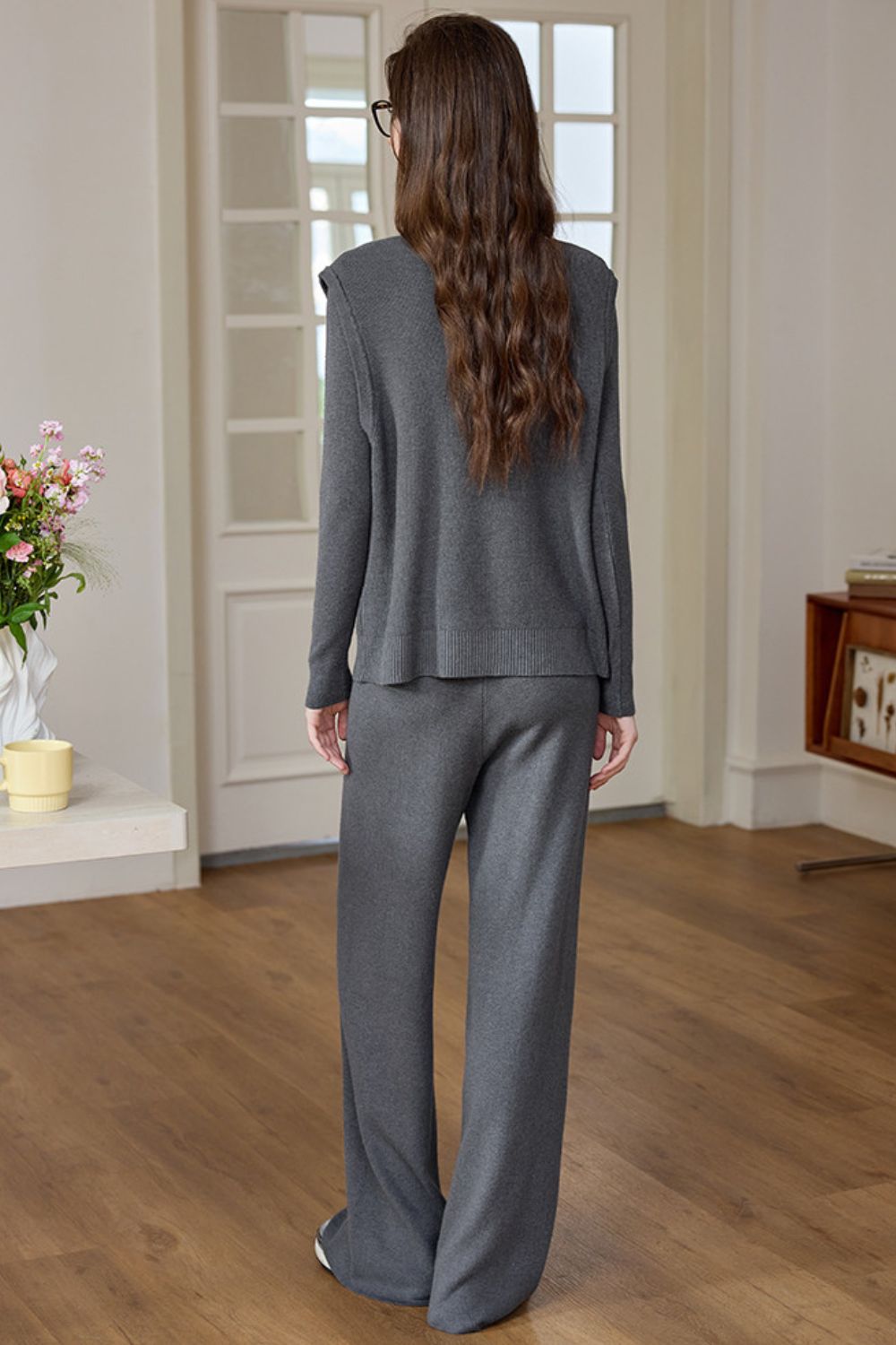 Rear view of dark gray knit lounge set with loose fit and flowy pants